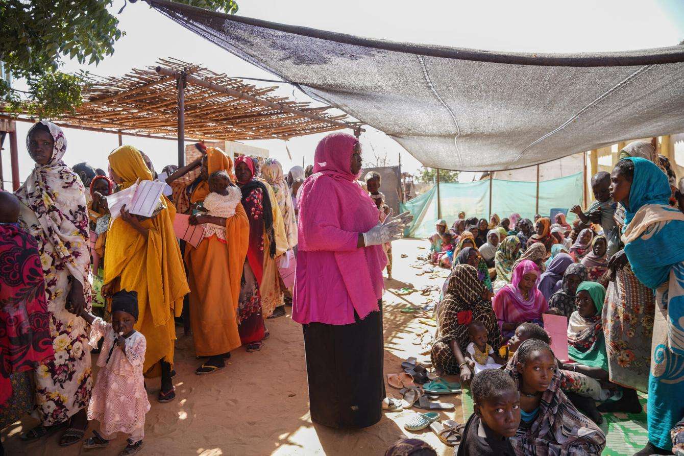 Women and children wait for therapeutic feeding in Zamzam camp, Sudan. 